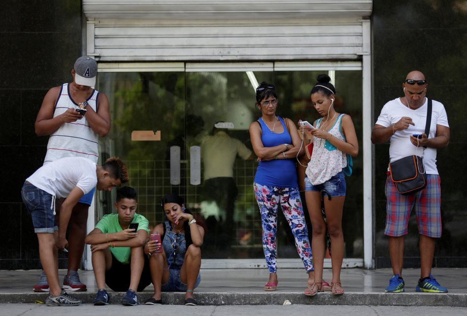 Cubans use the internet via public Wi-Fi in Havana, September 5, 2016.