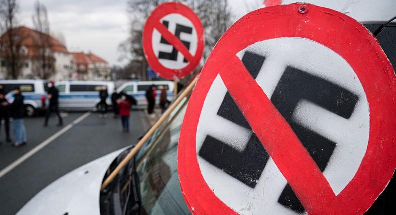 Anti-racism swastika signs seen during a demonstration in Dresden, Germany on April 10, 2021.
