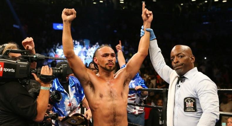 Keith Thurman celebrates his unanimous decision win over Shawn Porter in June 2016