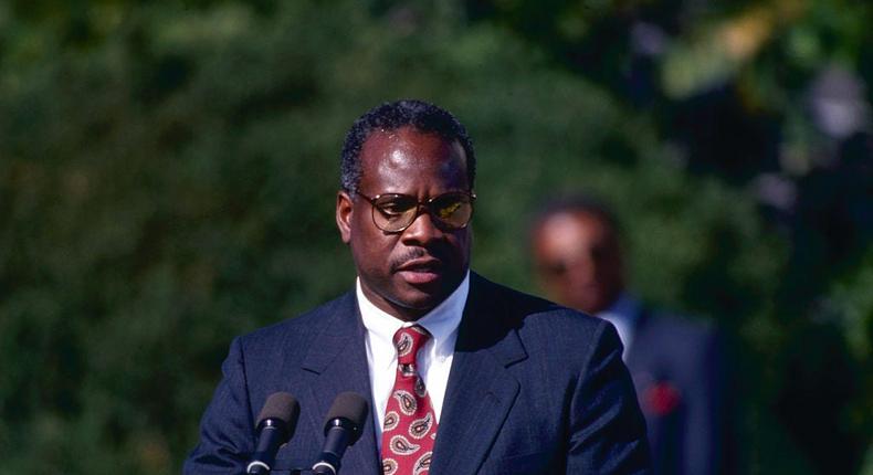 Judge Clarence Thomas is sworn in as the newest member of the Supreme Court on the White House South Lawn on October 18, 1991.