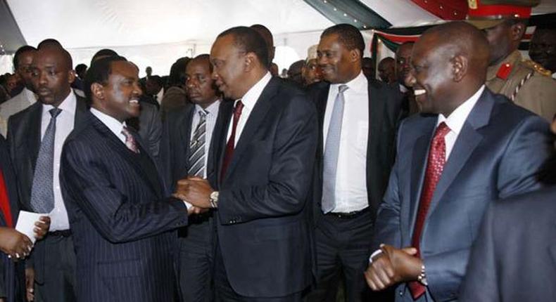 President Uhuru Kenyatta greeting Wiper Leader Kalonzo Musyoka as DP William Ruto watches