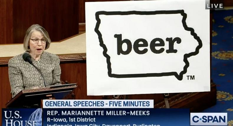 Rep. Marianette Miller Meeks presents a poster on the House floor.CSPAN/