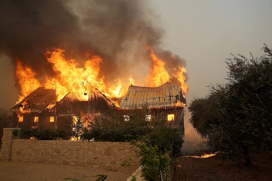 Fire consumes a barn as an out of control wildfire moves through the area on October 9, 2017 in Glen Ellen, California. Tens of thousands of acres and dozens of homes and businesses have burned in widespread wildfires that are burning in Napa and Sonoma counties.