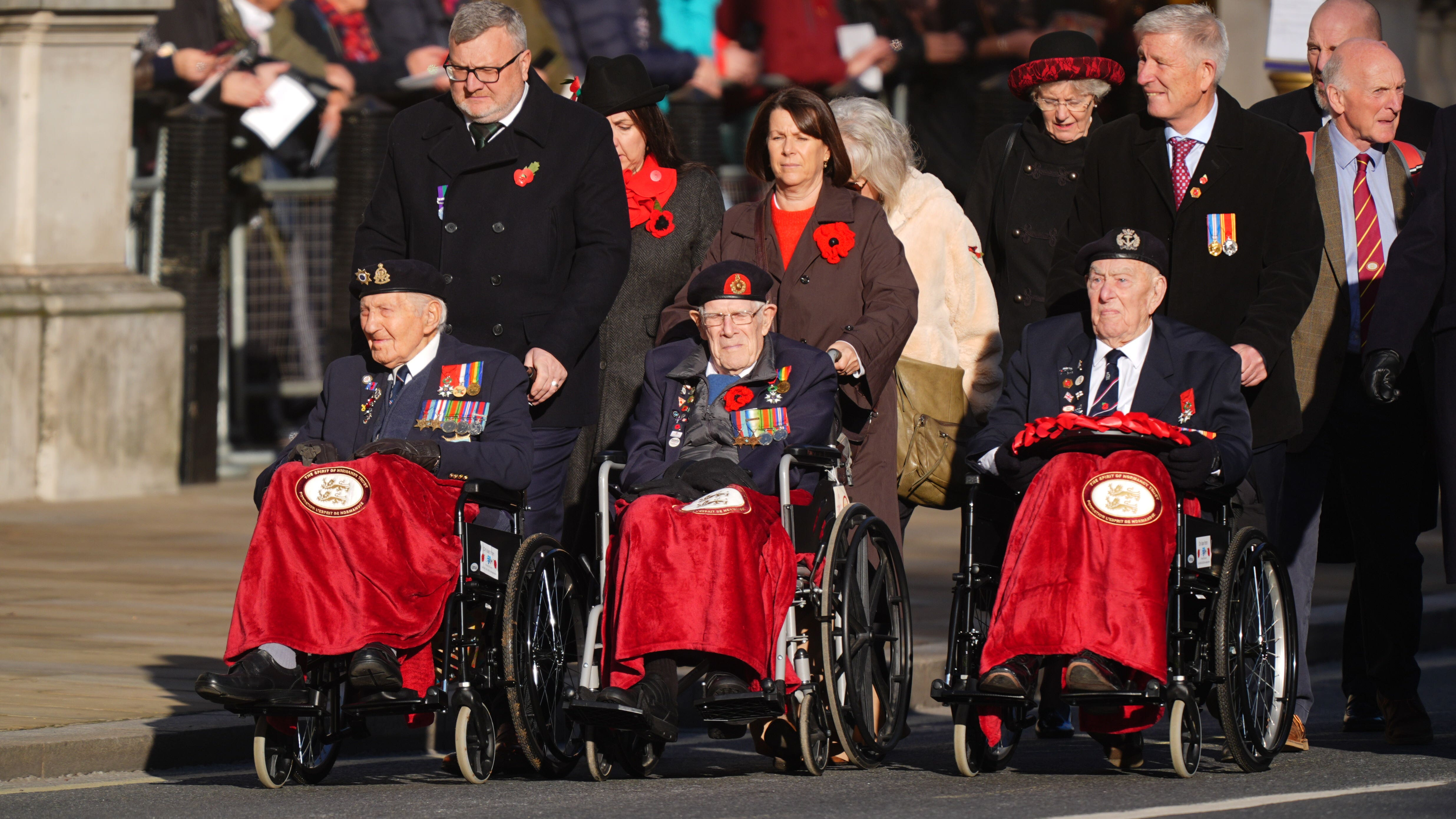 King Charles honors WWII heroes as 3 centenarian veterans march at 80th anniversary