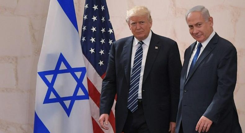 US President Donald Trump walks alongside Israeli Prime Minister Benjamin Netanyahu as he arrives to deliver a speech at the Israel Museum in Jerusalem on May 23, 2017