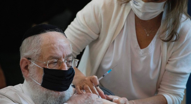 Rabbi Yisrael Meir Lau receives a COVID-19 coronavirus vaccine at the Ichilov Hospital in Tel Aviv, Israel, Sunday, December 20, 2020.
