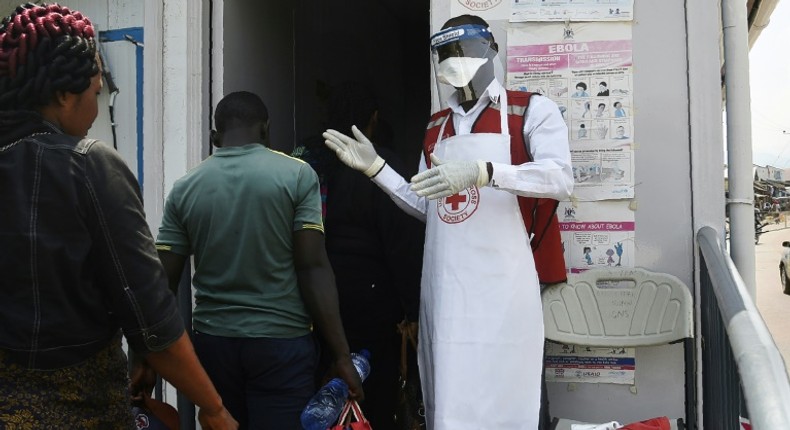 Health official screens travellers crossing Uganda's border to prevent Ebola outbreak