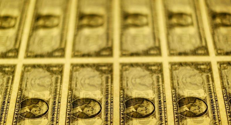 United States one dollar bills are seen on a light table at the Bureau of Engraving and Printing in Washington in this November 14, 2014, file photo. REUTERS/Gary Cameron/Files