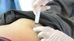 Injection syringe with medicine on the buttock