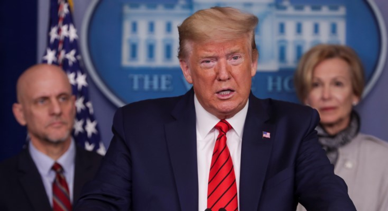 U.S. President Donald Trump stands with members of the administration's coronavirus task force as he addresses the coronavirus response daily briefing at the White House in Washington, U.S., March 19, 2020. REUTERS/Jonathan Ernst