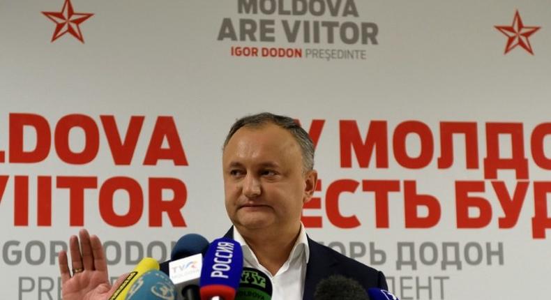 Moldova's presidential candidate Igor Dodon gestures during a press conference after the end of voting in Chisinau on November 13, 2016