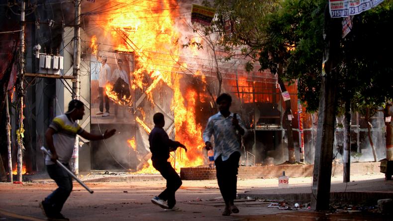 A garment store is reportedly set ablaze by a group of unidentified miscreants in Dhaka on August 4, 2024. [Getty Images]