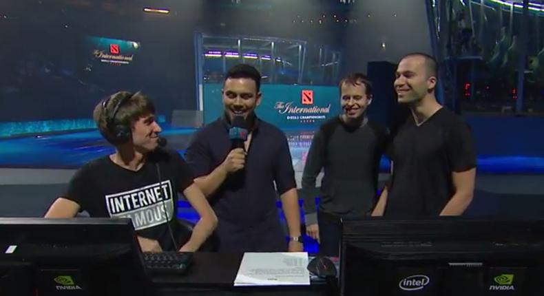 Dendi (far left) and OpenAI's Greg Brockman (right) talk it out ahead of the first match.