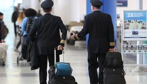 United Airlines pilots walk through Newark Liberty International Airport
