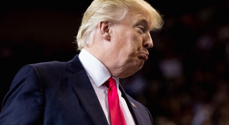 President Donald Trump reacts while speaking at a rally at the Kentucky Exposition Center in Louisville, Ky., Monday, March 20, 2017.