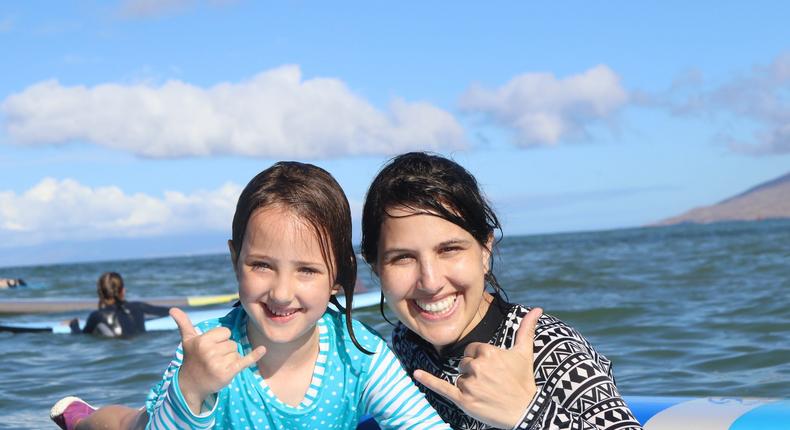 The author, right, surfing with her daughter.Courtesy of Saba Khonsari