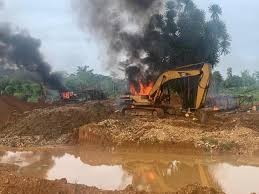 Professor Christopher Gordon kicks against burning of galamsey equipment