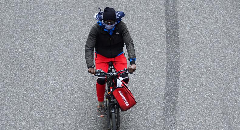 grubhub delivery bike NEW YORK, NEW YORK - MAY 18: A Grubhub delivery person rides a bicycle on 42nd street during the coronavirus pandemic on May 18, 2020 in New York City. COVID-19 has spread to most countries around the world, claiming over 320,000 lives with over 4.8 million infections reported. (Photo by Noam Galai/Getty Images)