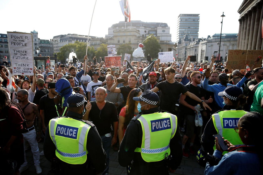 People gather in Trafalgar Square to protest against the lockdown imposed by the government, in Lond