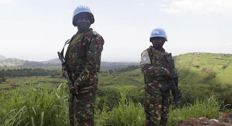 U.N. peacekeepers from Tanzania hold their weapons as they patrol outside Goma during a visit by officials from the U.N. Security Council in the eastern Democratic Republic of Congo, October 6, 2013. 