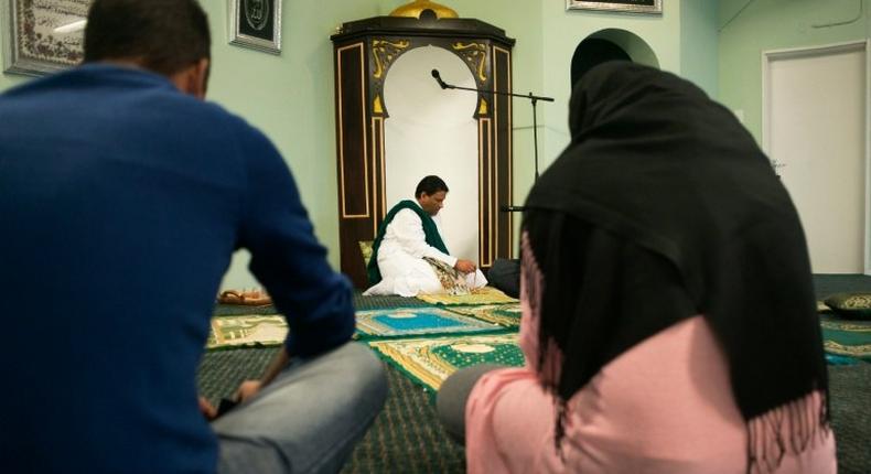 Imam Muhsin Hendricks (C) leads the start of the Jumu'ah prayer at the Inner Circle Mosque, in Wynberg, on September 2, 2016, in Cape Town