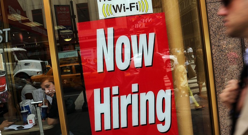 NEW YORK, NY - AUGUST 07: A 'now hiring' sign is viewed in the window of a fast food restaurant on August 7, 2012 in New York City.Spencer Platt/Getty Images