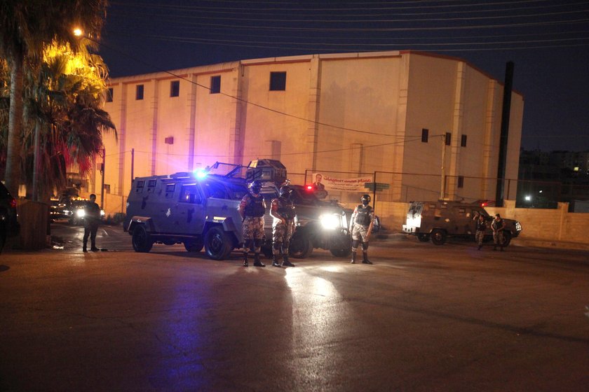 Policemen are seen near the Israeli embassy in Amman