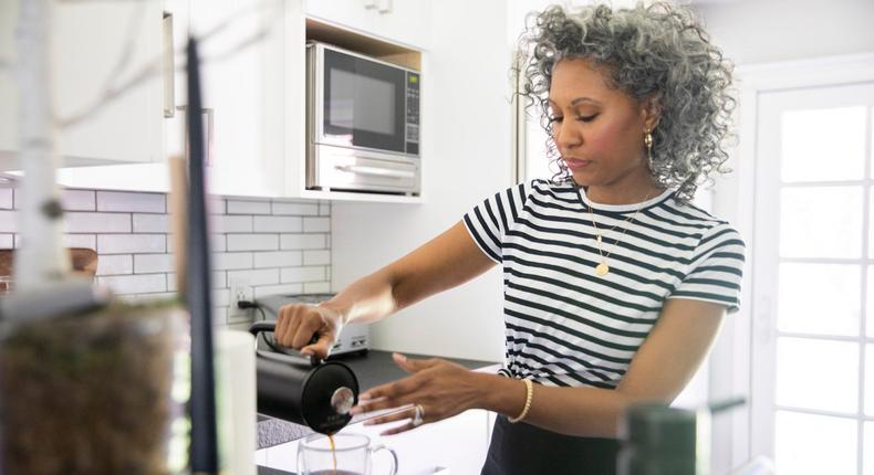 woman making coffee at home