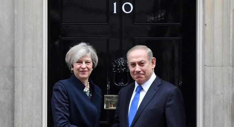 British Prime Minister Theresa May (left) shakes hands with Israeli Prime Minister Benjamin Netanyahu at 10 Downing Street in London on February 6, 2017