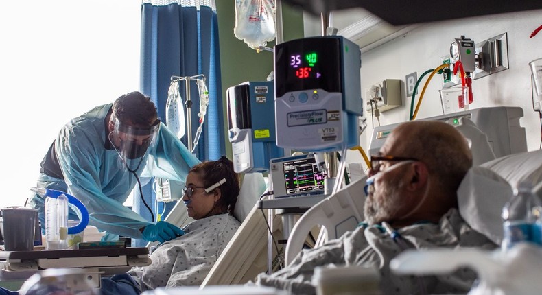 A doctor checks the vital signs of a patient at the Intensive Care Unit of  Providence Cedars-Sinai Tarzana Medical Center in Tarzana, California on January 3, 2021.
