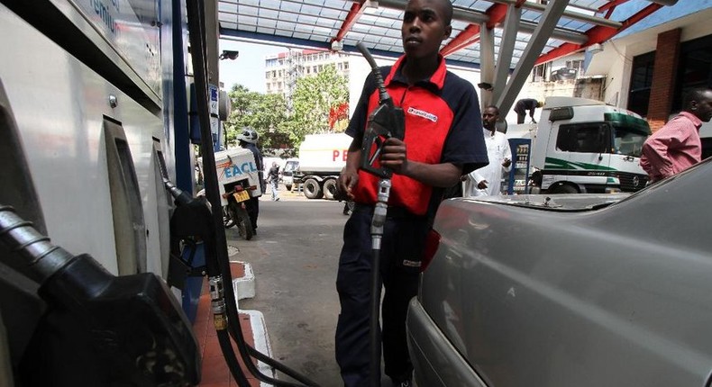 A petrol station attendant in Kenya