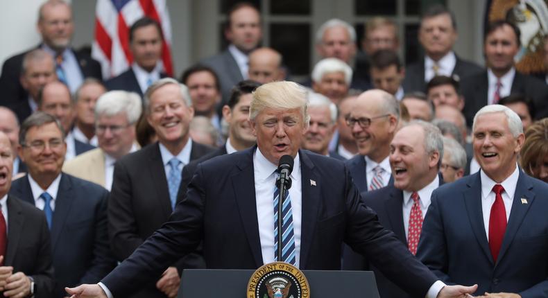 President Donald Trump celebrates the passage of the American Health Care Act through the House with Republican representatives on Thursday.