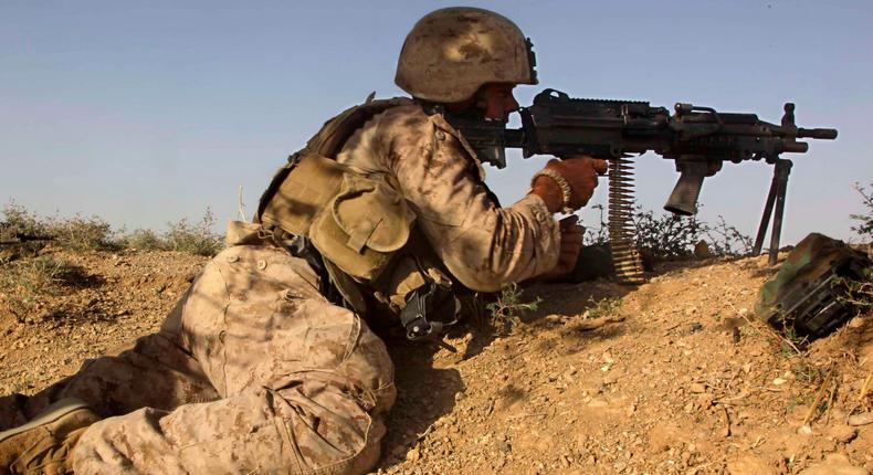 US Marine Lance Cpl. Will Betz aims at Taliban positions after being fired upon during a patrol in Helmand Province, Afghanistan, August 28, 2009.