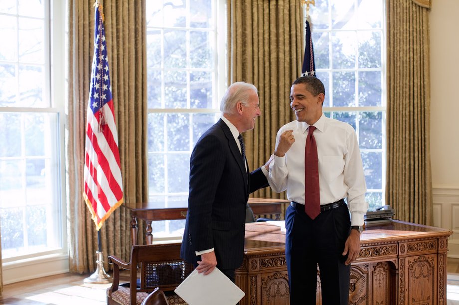 Obama and Biden share a laugh in the Oval Office.