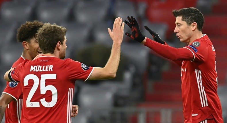 Lewandowski (R) celebrates scoring his 71st Champions League goal in Bayern Munich's win over Salzburg