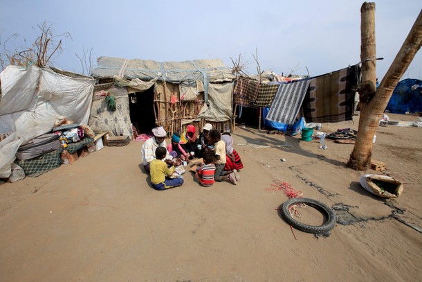 The Wider Image: Displaced Yemeni family sift through garbage for food