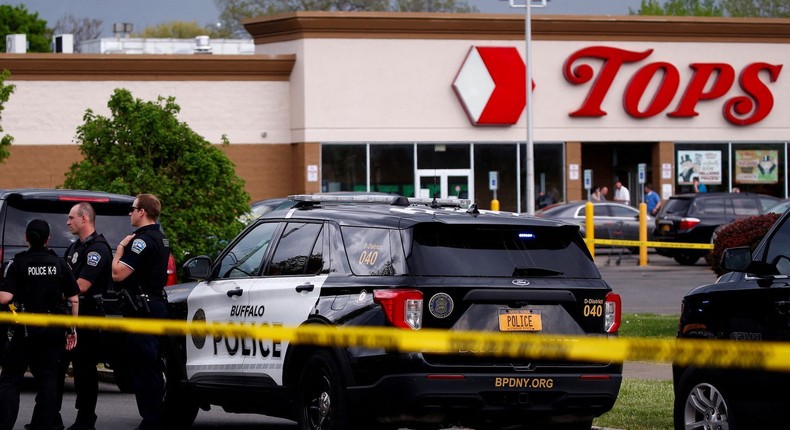 Police officers secure the scene after a shooting at TOPS supermarket in Buffalo, New York, U.S. May 14, 2022.Jeffrey T. Barnes/Reuters