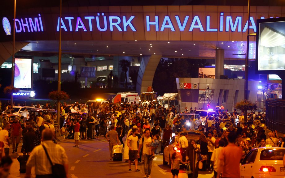 People leave Turkey's largest airport, Istanbul Ataturk, after a blast on June 28.