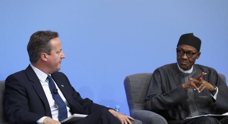 Nigerian President Muhammadu Buhari listens as British Prime Minister Cameron opens the international anti-corruption summit on May 12, 2016 in London, England. REUTERS/Dan Kitwood/Pool