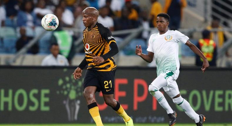 Kaizer Chiefs star Lebogang Manyama (L) is pursued by a Bloemfontein Celtic opponent during a South African Premiership match this season