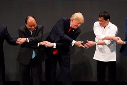 The internet is loving Trump's latest awkward handshake from his Asia trip