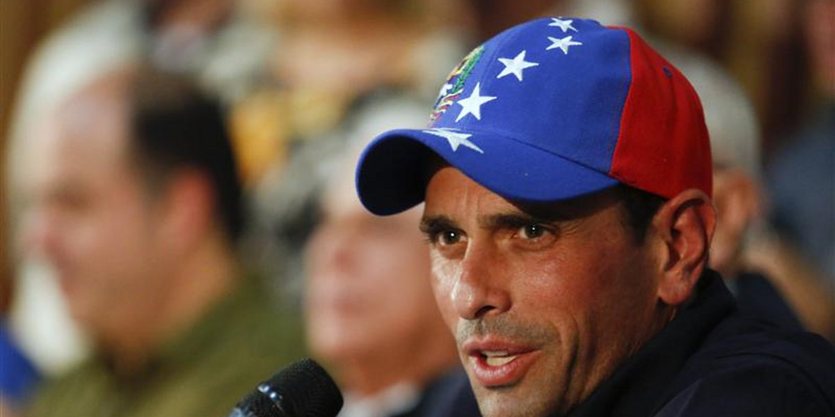 Venezuela's opposition leader and governor of Miranda state, Henrique Capriles, answers a question during a news conference in Caracas.