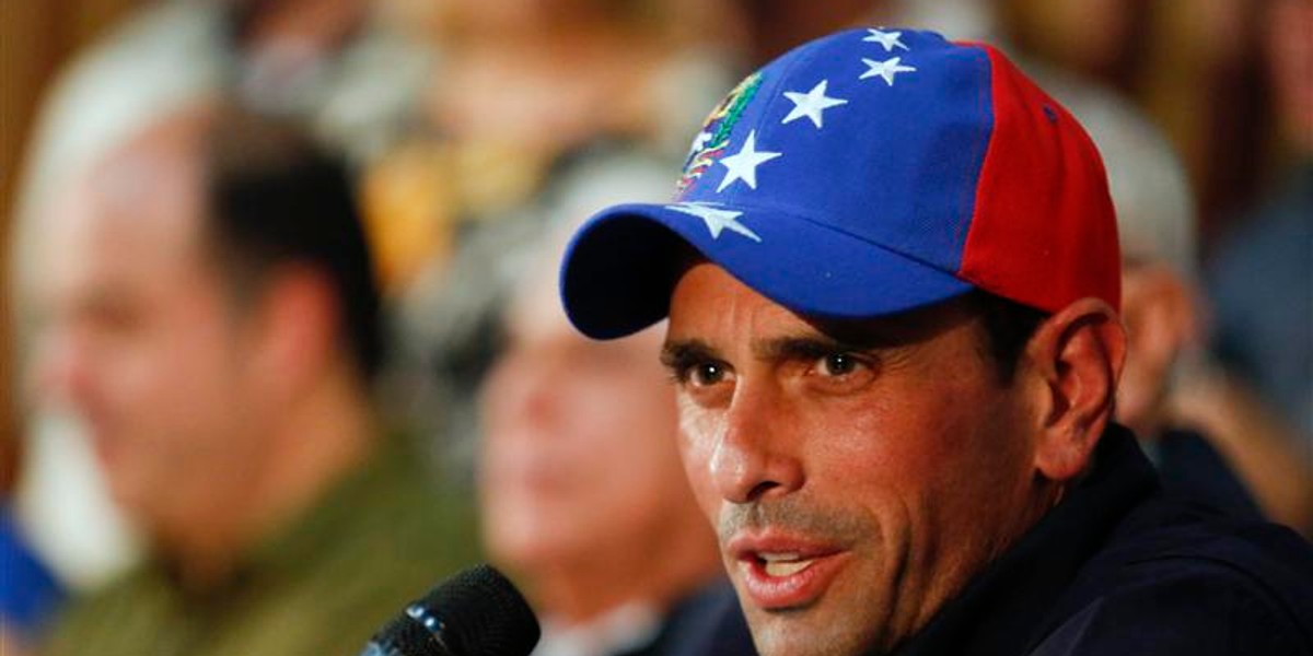 Venezuela's opposition leader and governor of Miranda state, Henrique Capriles, answers a question during a news conference in Caracas.