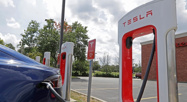 A Tesla at a Supercharger