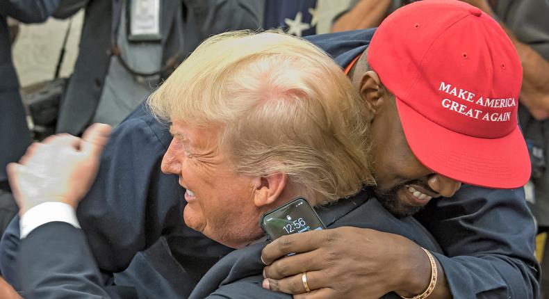 American rapper and producer Kanye West embraces real estate developer and US President Donald Trump in the White House's Oval Office, Washington DC, October 11, 2018.Ron Sachs/Consolidated News Pictures/Getty Images