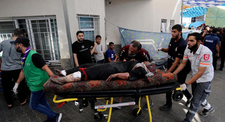 An injured Palestinian woman is wheeled into the al-Shifa hospital, following Israeli airstrikes on Gaza City, central Gaza Strip, Sunday, Nov. 5, 2023.AP Photo/Abed Khaled