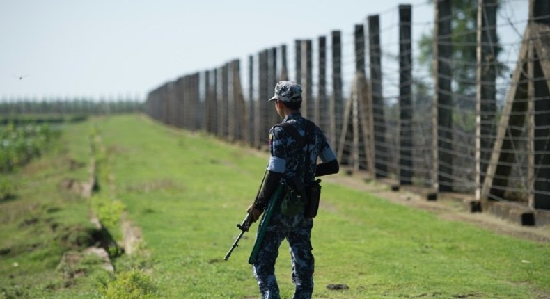 A military officer patrols the border fence along the river dividing Myanmar and Bangladesh located in Maungdaw, Rakhine State where there has been an upsurge of violence since October