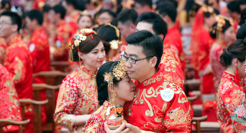 Alibaba employees at a mass wedding at their headquarters in Hangzhou, Zhejiang province, China.