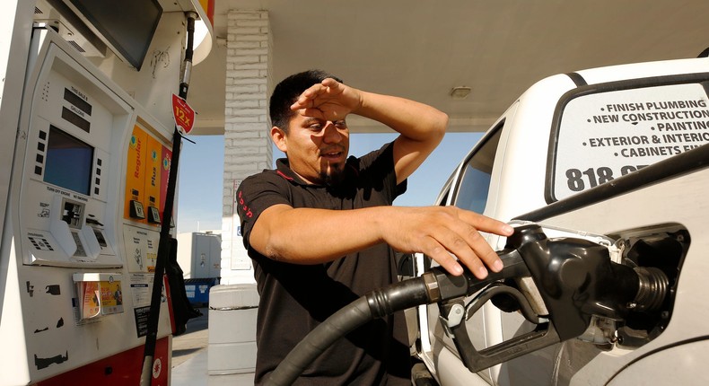 Alex Reyes, 28, began filling his work truck and stopped when he noticed the prices on the large marquee as drivers select from various fuels priced near of above over $6 dollars at a Shell gas station located at South Fairfax, West Olympic and San Vicente Blvd in Los Angeles