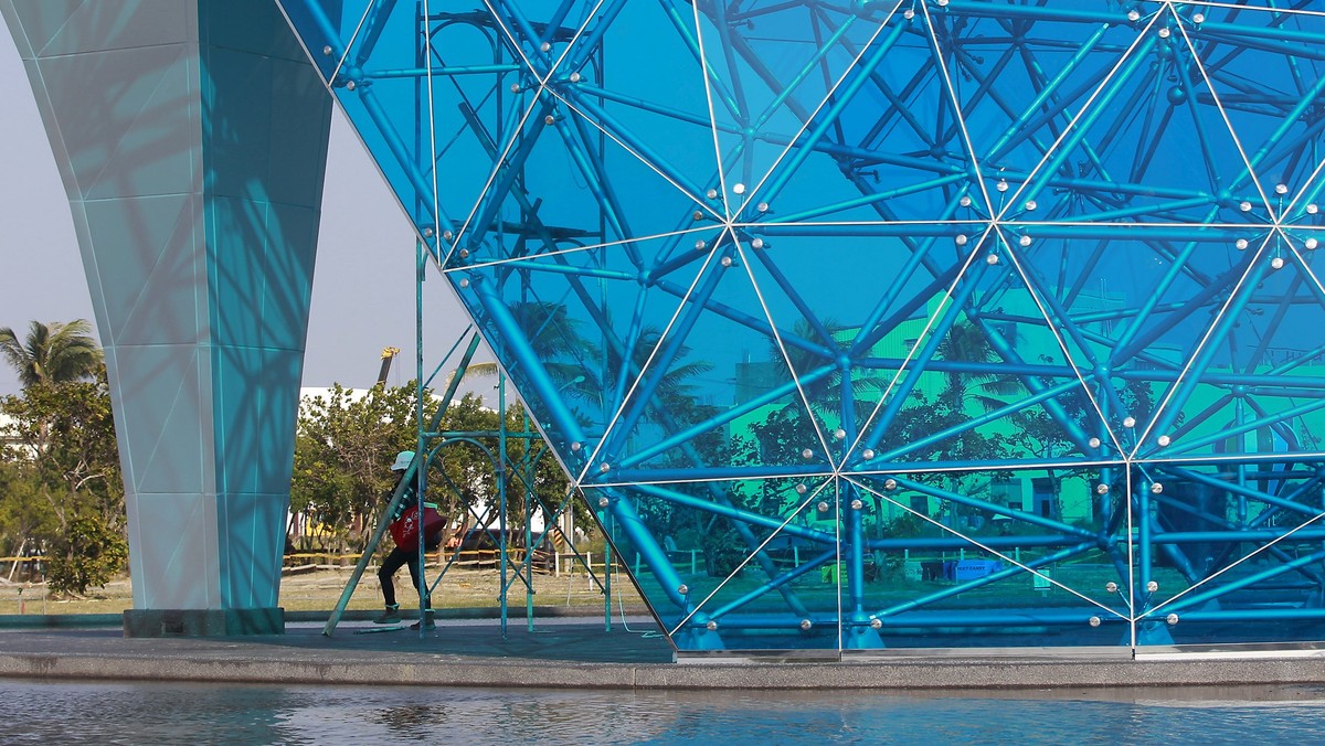 A construction worker walks in a shoe-shaped church in Chiayi